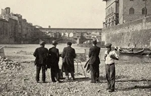 Ein Gruppenportrait mit einem Künstler, der Ponte Vecchio in Florenz malt