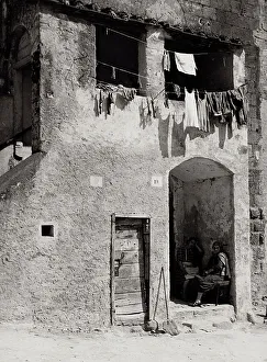 Civic Space Furniture Drucke: Rustic building with laundry hanging
