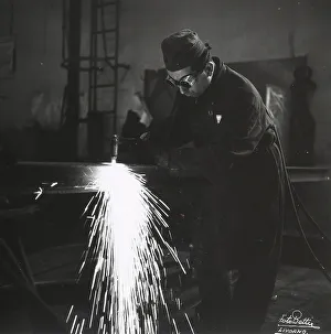 Industrial Worker Drucke: A welder using a blow-torch