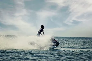 Caribbean Beach Scene Drucke: Man Jet skiing