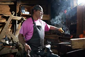 Blacksmith At Work Drucke: Blacksmith working in his forge