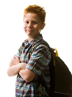 Caucasian Boy Looking At Camera Drucke: Boy with backpack
