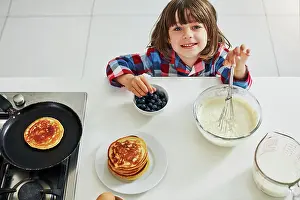 Cooking Healthy Meals At Home Drucke: Boy, bake and top in kitchen portrait