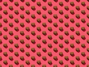 2021 Drucke: Schokoladenherzkaramell auf einem rosa Hintergrundmuster.