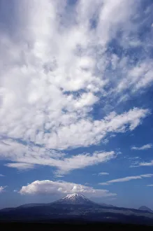 Tranquil Nature Scenes Drucke: Clouds over a snowcapped mountain