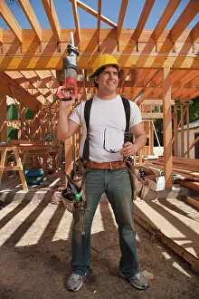 Residential Construction Site Drucke: Construction worker wearing a hard hat