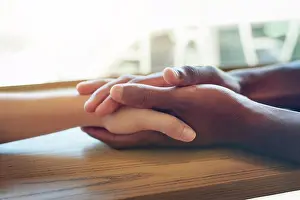 Interracial Friendship Drucke: Holding hands, interracial and together for support