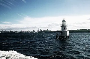 Australia Travel Destinations Drucke: Lighthouse with buildings in the background