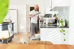 White Kitchen Drucke: Loading dishes in a sunny white kitchen