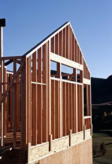 New Home Building Process Drucke: Low angle view of house under construction