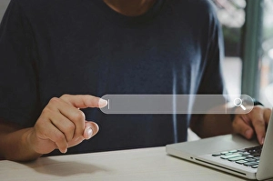 Man Typing On Laptop Drucke: Man hand using computer touch virtual search icon
