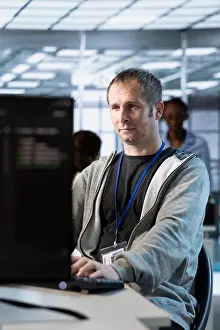 Data Backup Solutions Drucke: IT professional optimizing data center gear for maximum efficiency and uptime