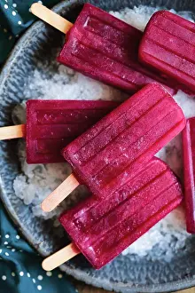 Frozen Food Photography Drucke: Red popsicles on ice