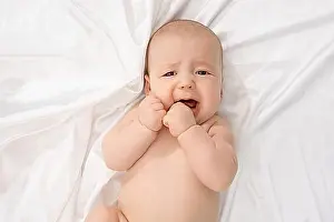 Caucasian Child Portrait Drucke: Top view of child crying while looking at camera