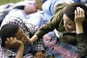 African Ethnicity Drucke: Young couple lying down together