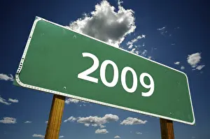 Cloudy Sky Image Drucke: 2009 road sign with dramatic clouds and sky