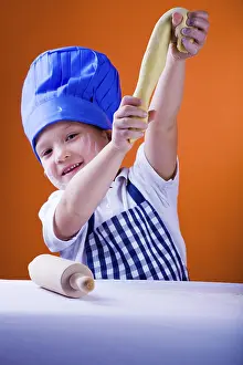 Boy Baking Cookies Drucke: A 6 years old boy baking bread