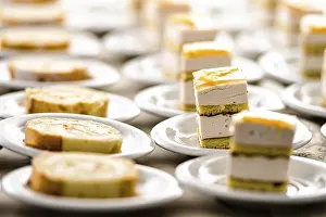Shallow Depth Of Field Desserts Drucke: Abstract background of many rows of cake dessert plates
