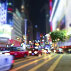 Illuminated Skyscrapers Drucke: Abstract cityscape blurred background