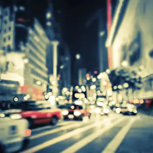 Illuminated Skyscrapers Drucke: Abstract cityscape blurred background