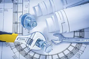 Construction Industry Technical Drawing Drucke: Adjustable key spanner bolts nuts and blueprints construction concept