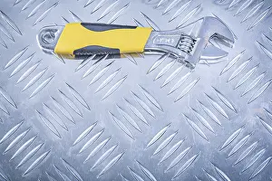 Adjustable Spanner Drucke: Adjustable spanner on chequer plate Design concept