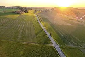 Empty Roads In Europe Drucke: Aerial view of a road between fields