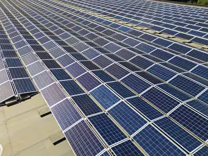 Sustainable Solar Power Generation Drucke: An aerial view of a solar panel array in Switzerland
