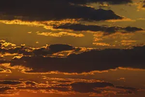 African Evening Atmosphere Drucke: African sunset clouds in orange and red. Namibia