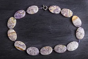 Precious Stone Gift Drucke: Agate colored beads on a black background