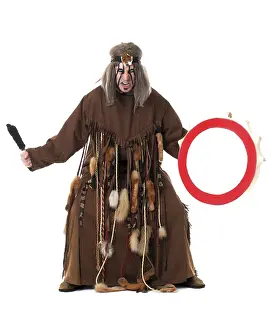 Music Instrument Photography Drucke: Aggressive middle-aged shaman posing at camera