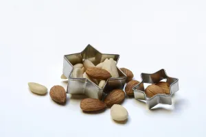 Advent Season Desserts Drucke: Almonds and biscuit cutters for biscuits