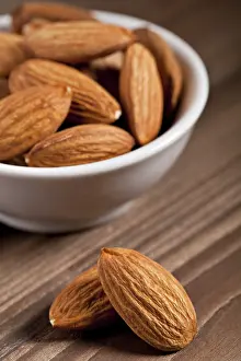 Studio Shot Of Almonds Drucke: almonds isolated on the white background