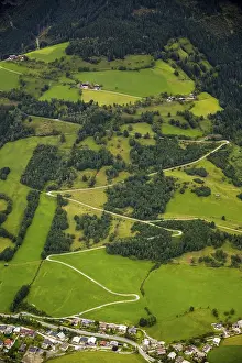Aerial View Of Austria Drucke: Alpine meadows with serpentine paths
