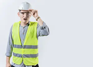 Young Engineer Drucke: Amazed engineer looking into the distance isolated