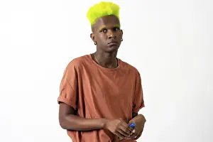 Androgynous Black Man Drucke: An androgynous black man posing in a studio on a white background