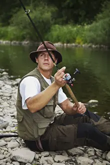 Recreational Fishing Activity Drucke: Angler casting a line