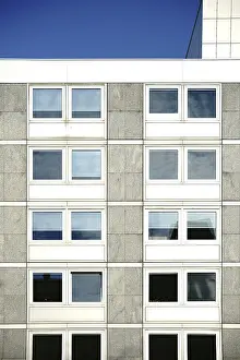 Uninhabited Construction Site Photo Drucke: The angular exterior facade of a school building with large windows The angular exterior fa