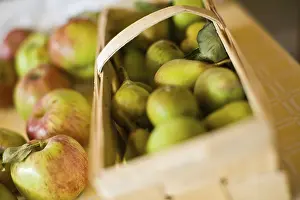 Close Up Fruit Photography Drucke: Apples next to pear basket
