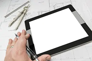 Residential Architecture Drucke: Architech working on blank computer tablet