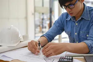 Architectural Design Drucke: An architect and engineer carefully using a compass to create house plans