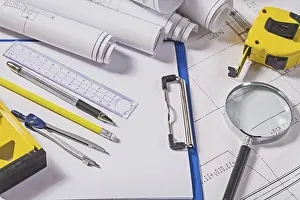 Building Construction Plan Drucke: Architect tools on blueprints