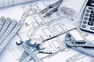 European Construction Project Drucke: An architect's construction plan with a calculator