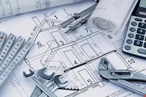 European Construction Project Drucke: An architect's construction plan with a calculator