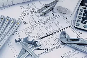 European Construction Project Drucke: An architect's construction plan with a calculator