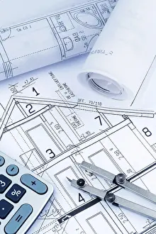 Architectural Planning Drucke: An architect's construction plan with a calculator