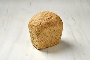 Bakery Products Photography Drucke: Artisan bread made from oats seeds on kitchen table