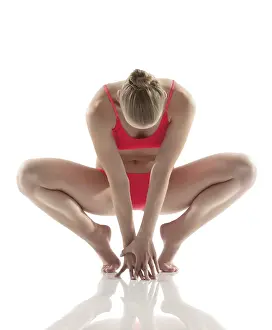Athletic Pose Drucke: Artistic gymnast performs exercises in studio
