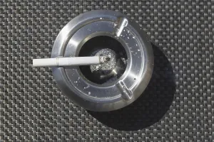 No People Smoking Drucke: Ashtray with a cigarette