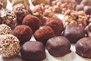 Appetizing European Desserts Drucke: Assorted Chocolate candies on the white table